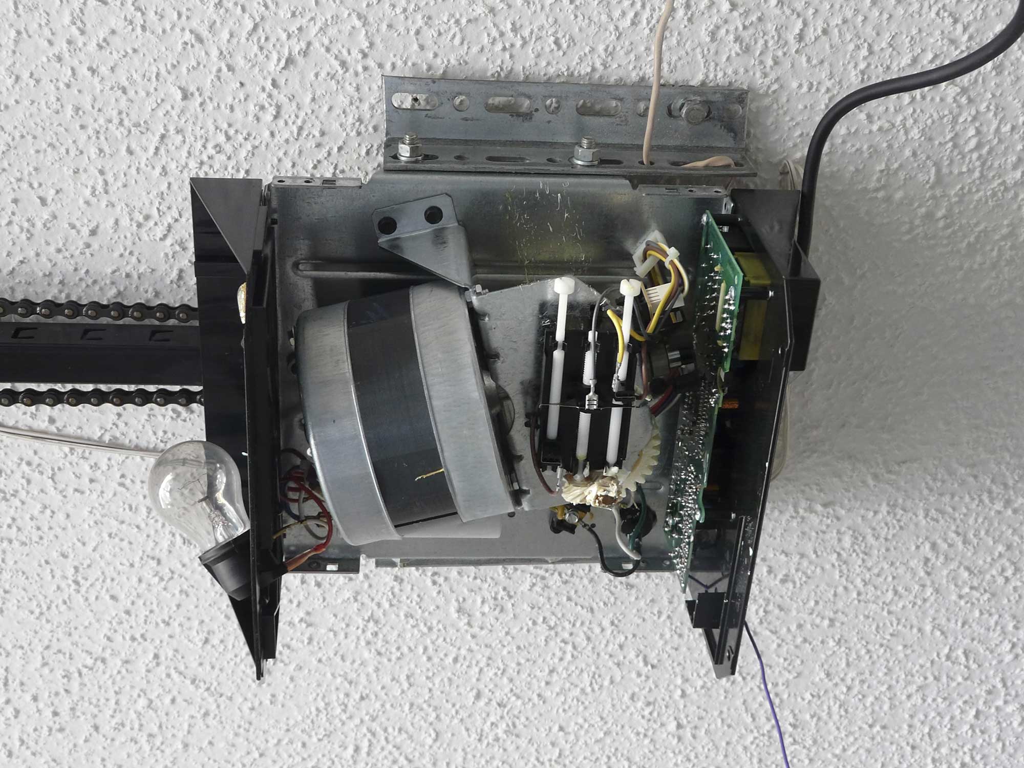 Inside view of a broken Garage Door Opener Inside view of a broken Garage Door Opener