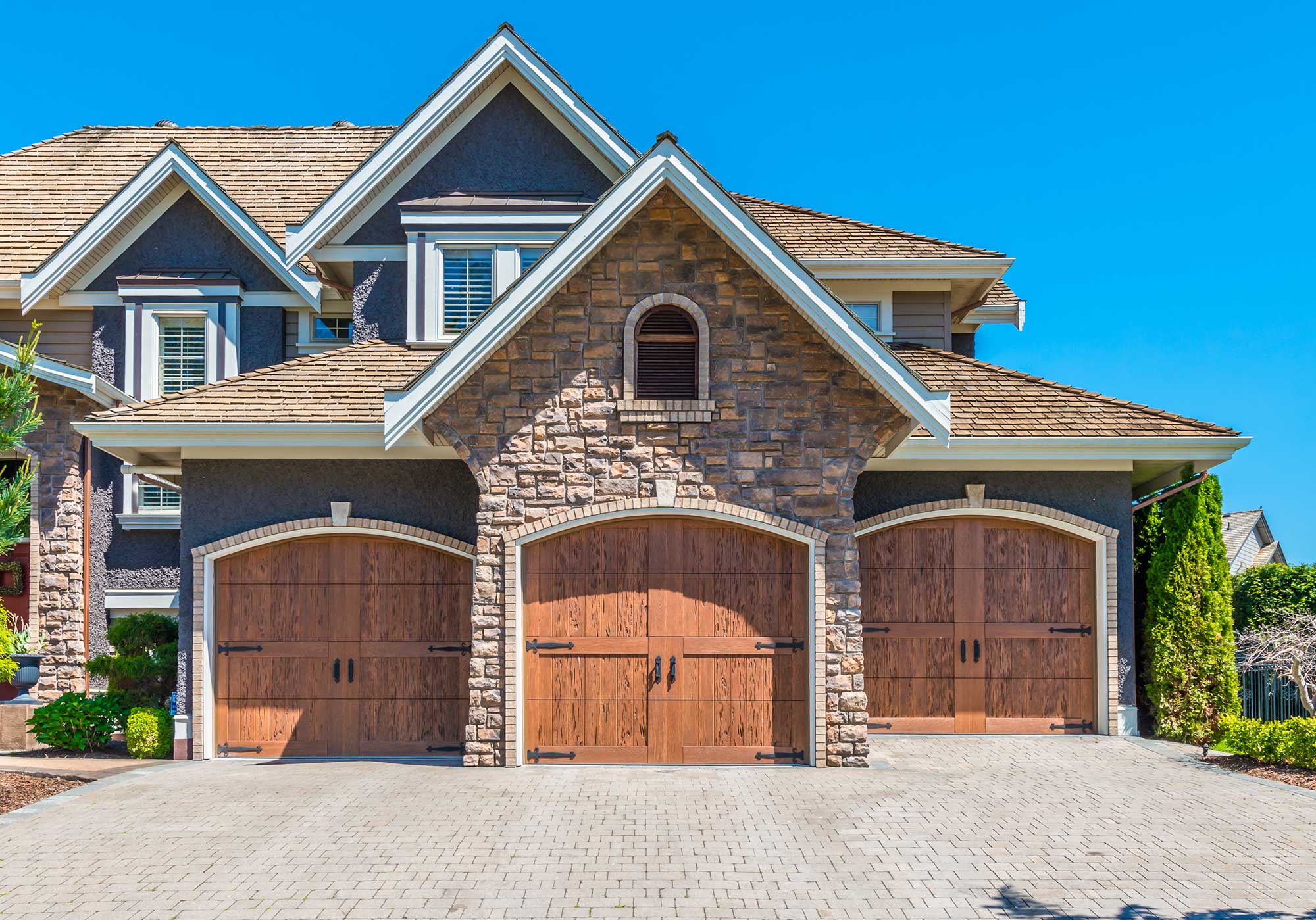 Marble Falls home with swing out garage doors.