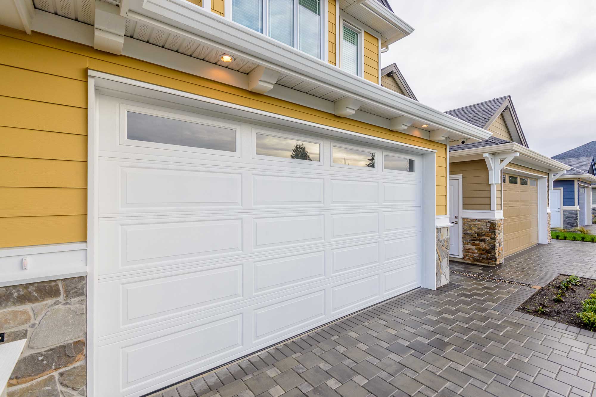 Meta Garage Doors with White Finish and Windows