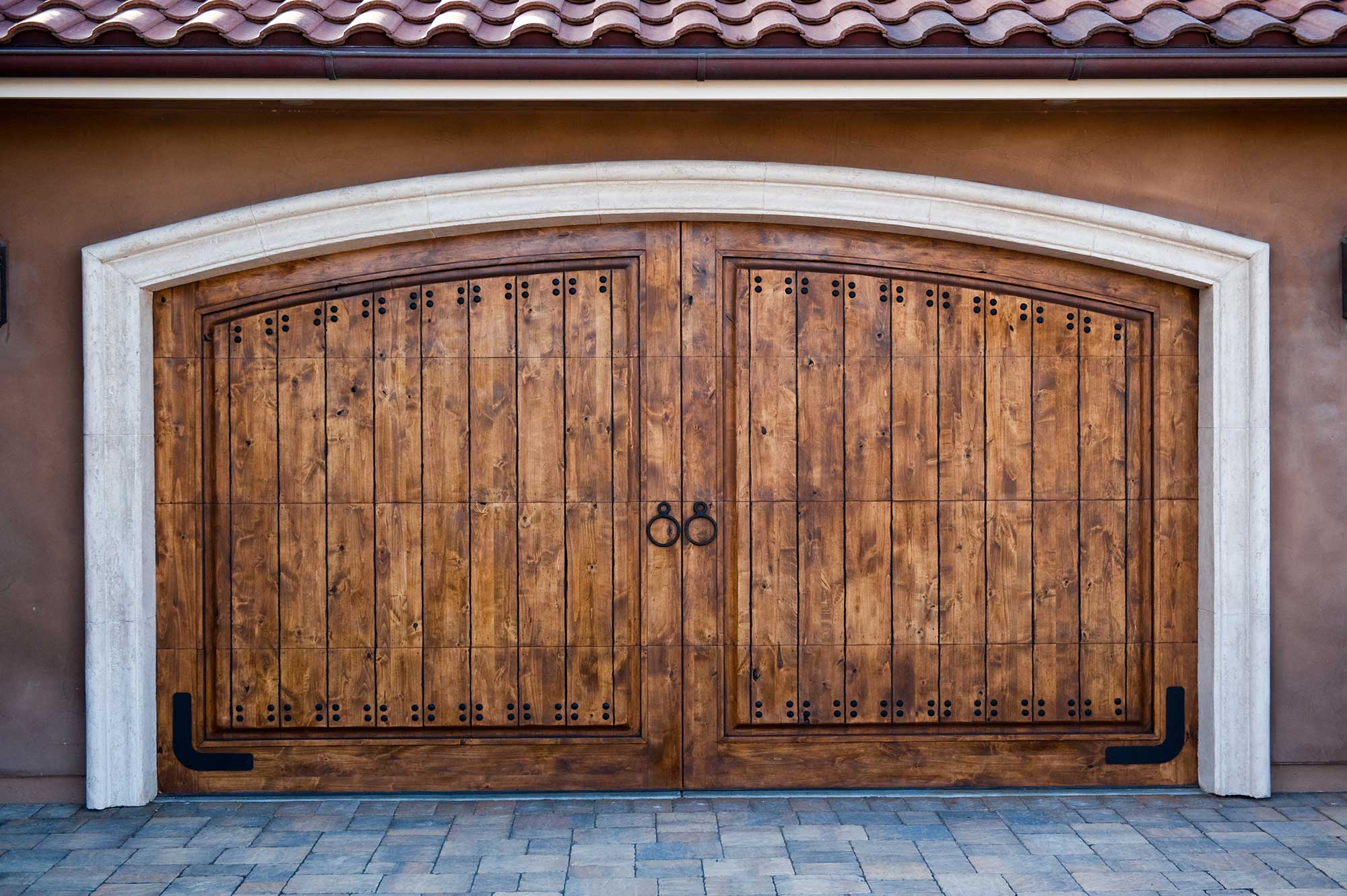 New wood stained carriage house garage door.